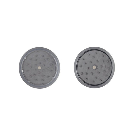 2pcs Metal 3 Magnetic Grinder close-up, featuring a circular metal surface with holes, showcasing its durable design and efficiency for herb grinding.