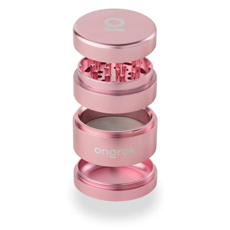 4pcs Aluminum 2.6 EZ Grinder showcasing a pink metal exterior, triangular teeth, and deep chambers for grinding and storing herbs efficiently.