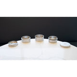 5pcs Aluminum 3 Pyramid Teeth Grinder with Storage, featuring durable aluminum construction, multi-chamber system, and pyramid-shaped teeth, displayed on a white table with other silver containers.