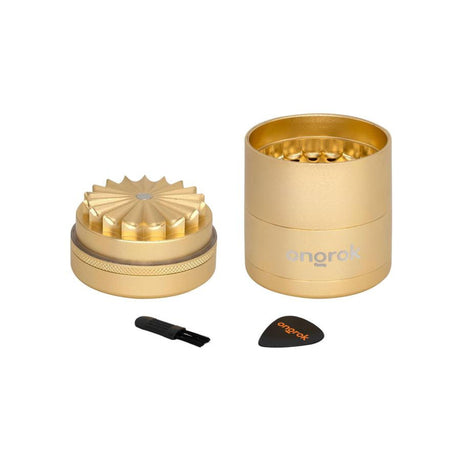 Mini 5 Piece Flower Petal Toothless Grinder with Storage - Black, featuring a gold cylinder design, black brush, and airtight storage for consistent, fine grinding.
