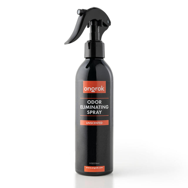 Odor Eliminating Spray - Unscented - 8oz in a sleek black bottle with a black spray handle, designed to neutralize odors on various surfaces.