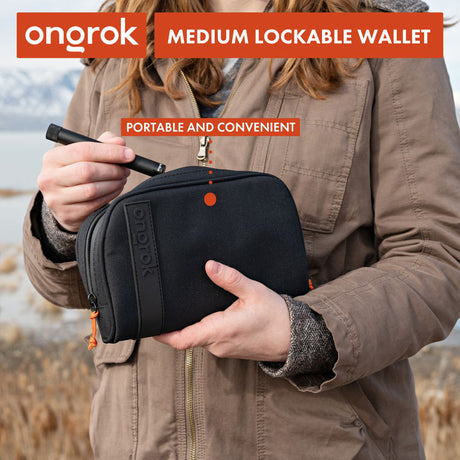 Smell Proof Water-Resistant Wallet held by a woman, showcasing its compact design. Features secure compartments and a combo lock for added security.