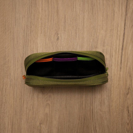 Smell Proof Water-Resistant Wallet with zipper, showcasing elastic webbing and compartments for secure organization, made from durable 1000D poly fabric on a wooden surface.