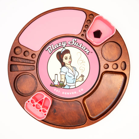 Spinning Rolling Tray: A wooden organizer with multiple compartments, removable pink silicone inserts, and a Blazy Susan logo, designed for neat storage and easy accessibility.