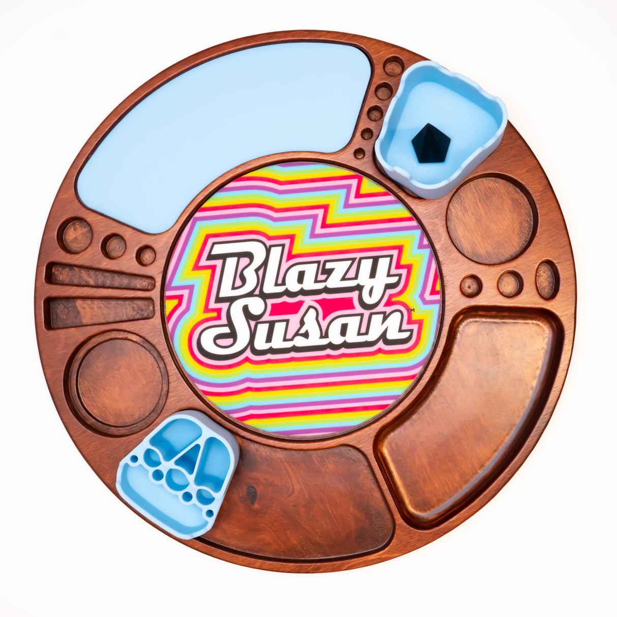 Spinning Rolling Tray: Round wooden tray with central Blazy Susan logo, recessed compartments, and removable blue silicone inserts for organized tobacco or cannabis preparation.