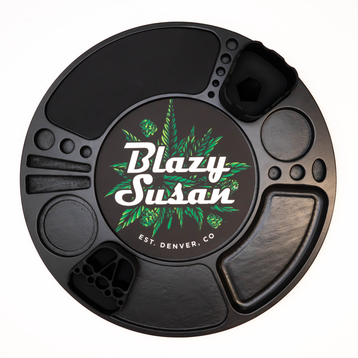 Blazy Susan Spinning Rolling Tray: Black round rotating organizer with compartments for cannabis accessories, featuring a cannabis-leaf logo and Blazy Susan branding at the center.
