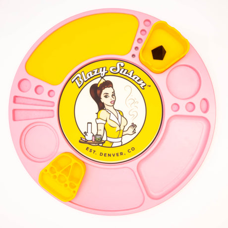 Blazy Susan Spinning Rolling Tray: round silicone tray with compartments, includes yellow insert cups and pin-up logo, for organizing smoking materials.