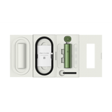 Pax Dry Herb Vaporizer in Greenstone color. Open white box with accessories