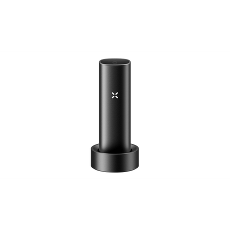 PAX FLOW vaporizer in charging cradle with visible PAX logo, showcasing its sleek, portable design and advanced technology for dry herb vaping.