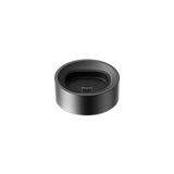 PAX FLOW Charging Dock: A sleek, matte black circular dock with USB-C plug, designed for efficient charging and organization of the PAX FLOW device.