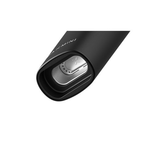 Close-up of PAX Mini vaporizer showing the exposed stainless-steel heating chamber and mouthpiece, highlighting its compact design and advanced features for smooth, flavorful sessions.