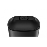 Close-up of the PAX Mini, a matte-black, cylindrical dry herb vaporizer with a removable lid featuring an X-pattern vent, designed for portable, flavorful sessions.