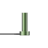 PAX FLOW vaporizer, a matte-green metal cylinder on a round base with a black braided power cable, showcasing its sleek, portable design.