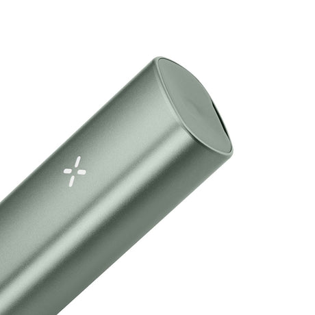 Close-up of the PAX Plus Dry Herb Vaporizer, showcasing its sleek, silver cylindrical design, emphasizing its compact, dual-use functionality for on-the-go vaping.