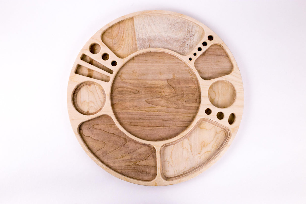Spinning Rolling Tray: A circular wooden board with recessed compartments for organized use, featuring a central well and rotating design for 360° accessibility.