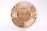 Spinning Rolling Tray: A circular wooden board with recessed compartments for organized use, featuring a central well and rotating design for 360° accessibility.