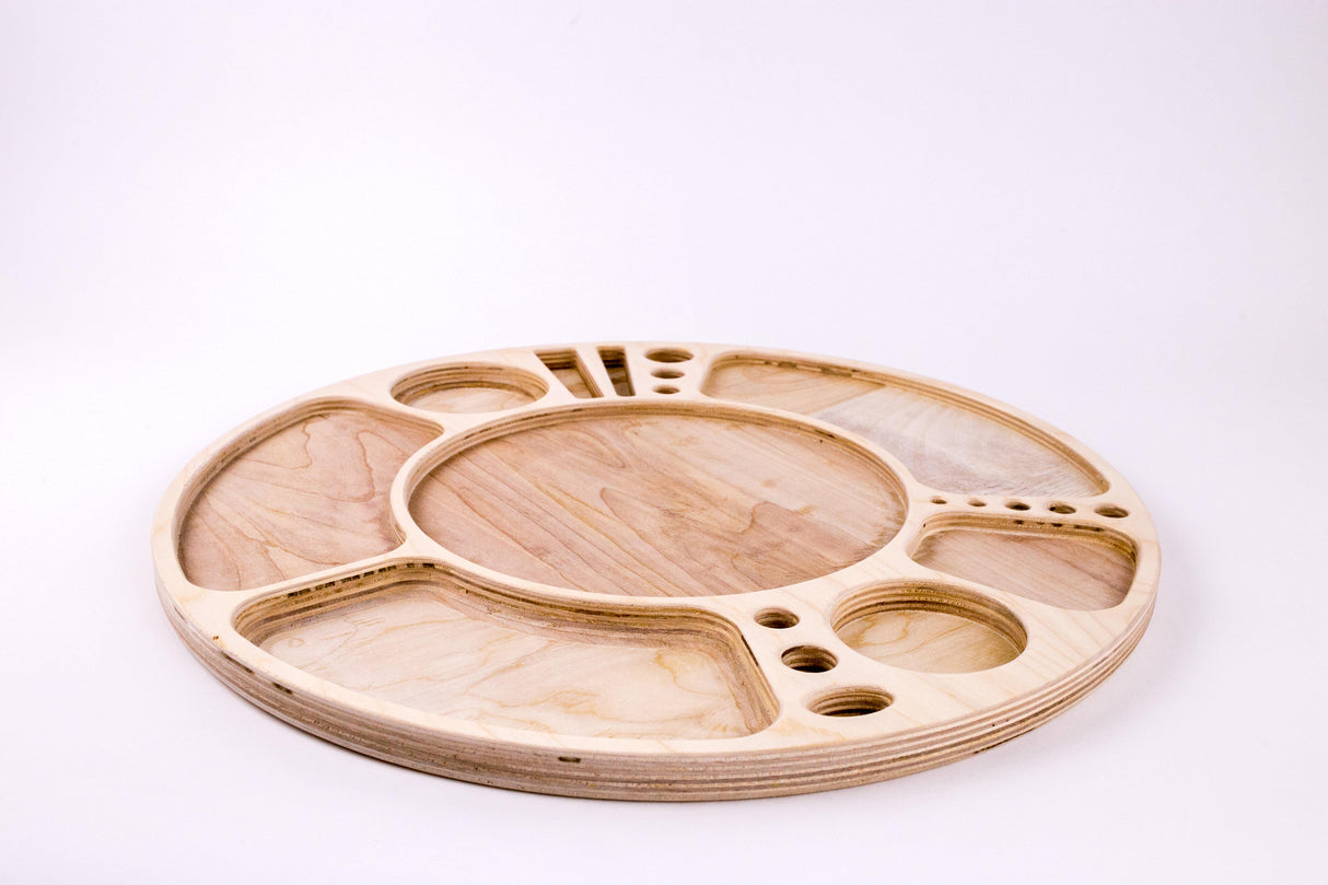 Spinning Rolling Tray: A round, laser-cut plywood accessory platform with a rotating base, featuring a central well and multiple compartments for organized display or use.