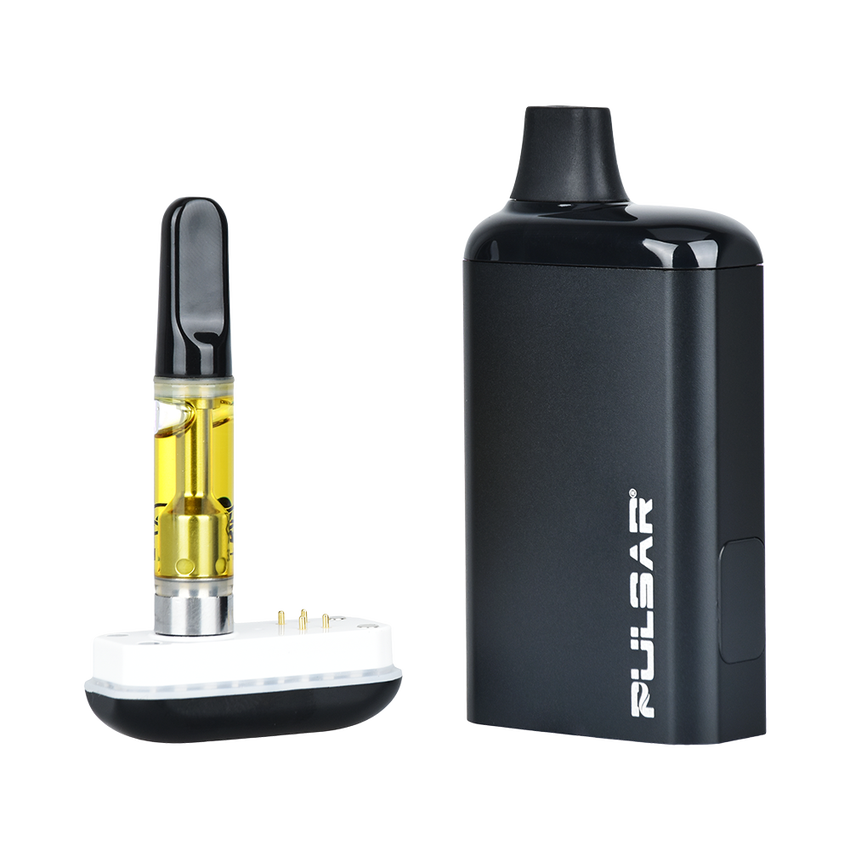 DL 2.0 PRO Auto-Draw VV 510 Battery beside oil-filled vape cartridge in charger dock, showcasing its sleek design and compatibility.