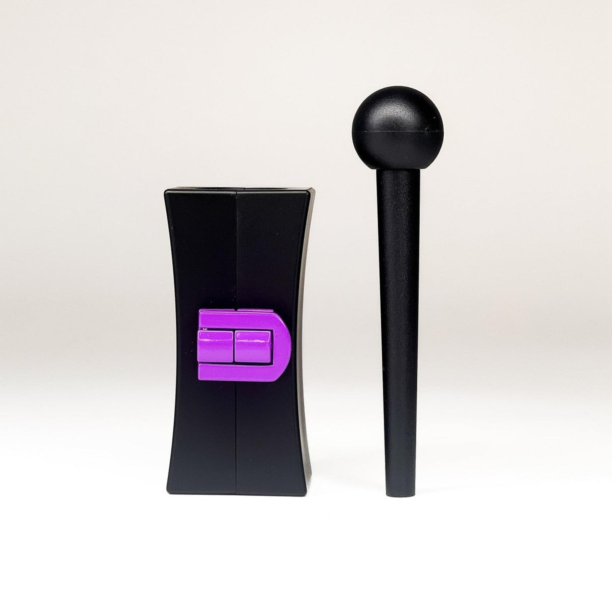 Cone Mold CannaMold - Fits 1g: Black hourglass block with purple latch and a black rod with spherical end, components for crafting slow-burning, perfectly packed cones.