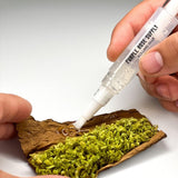 Rolling Glue Box - 4 ml - Carton of 24, featuring a hand holding a pipette and a tube, highlighting its spit-free adhesive and built-in brush for precise application.