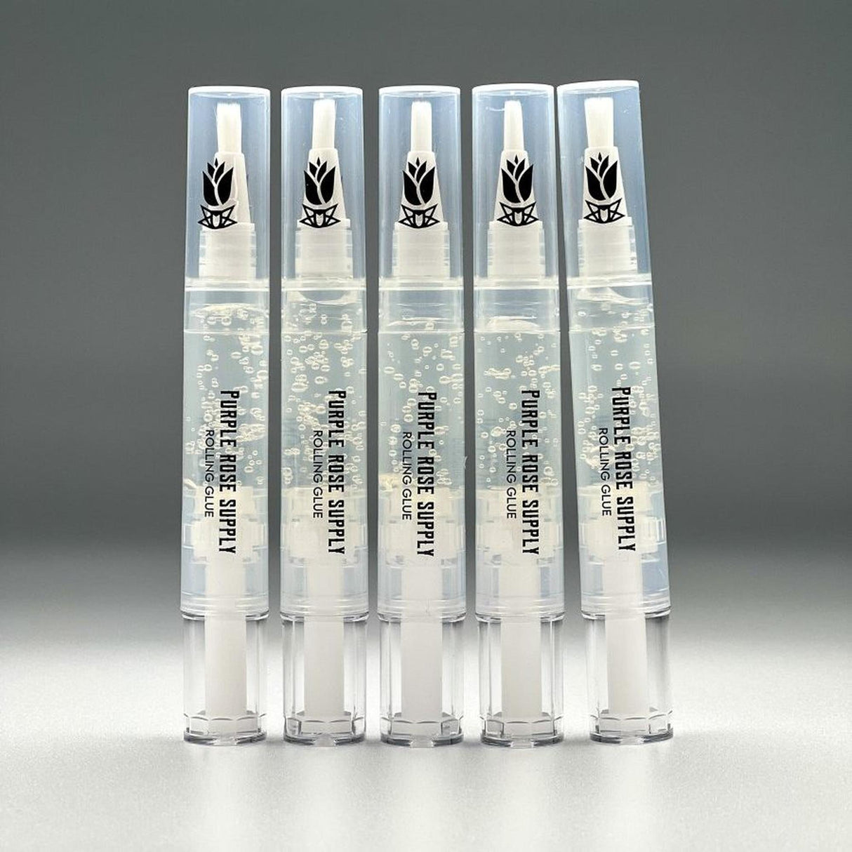 Rolling Glue Box - 4 ml - Carton of 24, featuring clear pens with white caps, perfect for spit-free rolling. Compact, precise, and retail-ready for smoke shop displays.