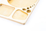 Blazy Susan Dab Tray: CNC-cut birch organizer with multi-compartment layout, featuring wells and holes for efficient, compact desk use.