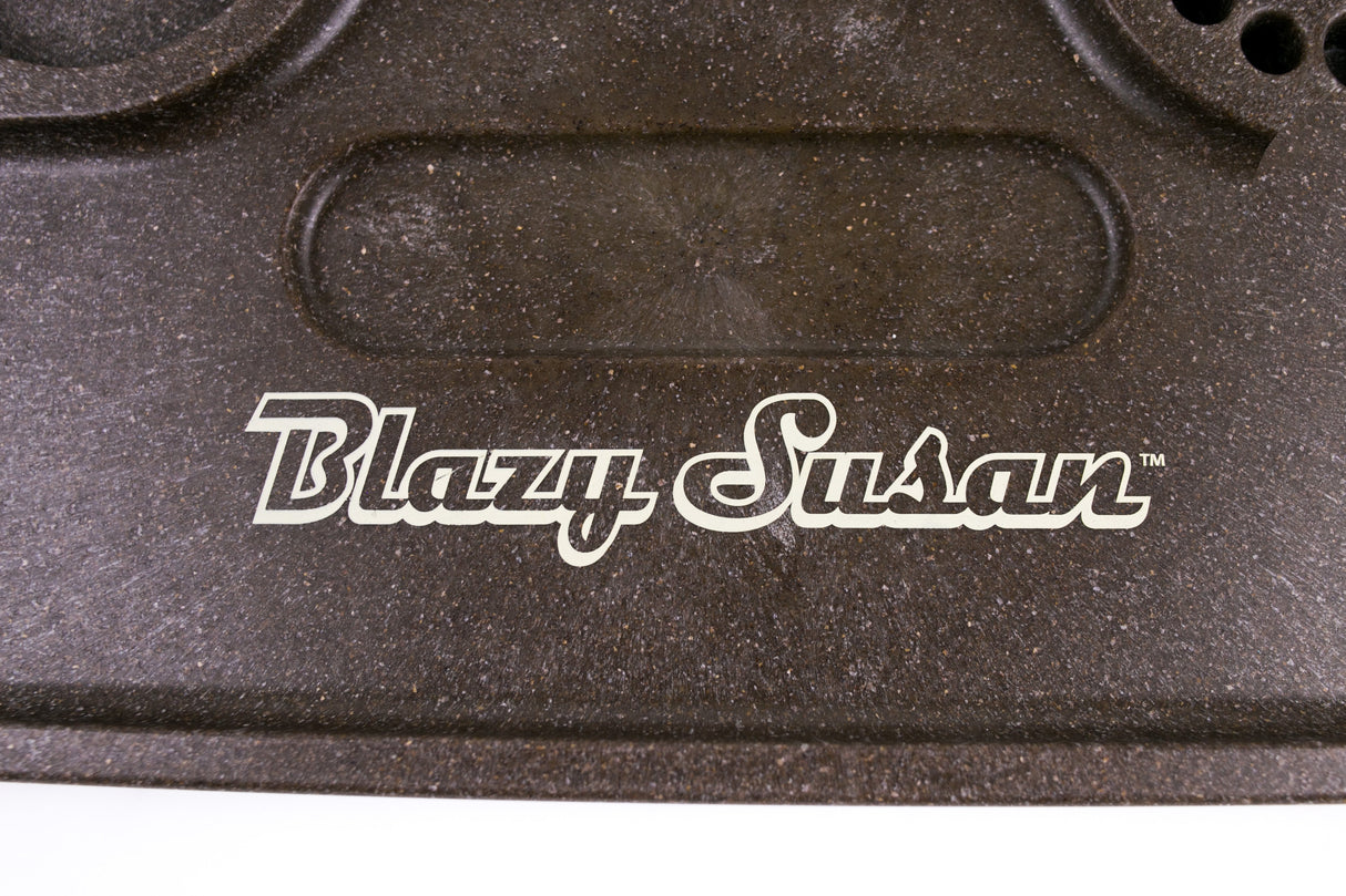 Close-up of the Blazy Susan Hemp Plastic Rolling Tray, showcasing its durable, speckled surface and white logo, emphasizing its eco-conscious, biodegradable construction.
