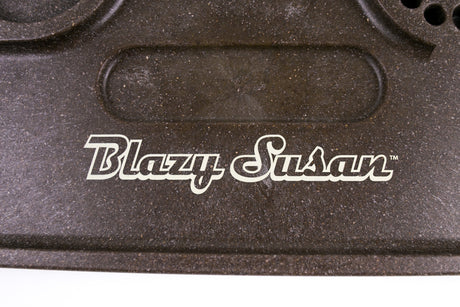 Close-up of the Blazy Susan Hemp Plastic Rolling Tray, showcasing its durable, speckled surface and white logo, emphasizing its eco-conscious, biodegradable construction.