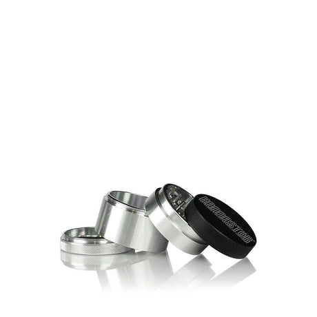 2.2 Kannastör Multi-Chamber Grinder - Silver, shown unscrewed with visible grinding teeth, magnetic lid, deep storage chamber, and Easy Change Screen system.
