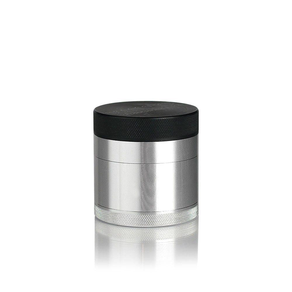 2.2 Kannastör Multi-Chamber Grinder - Silver, showing its cylindrical design with knurled base, grinding chamber, black lid, and magnetic closure for precise herb grinding.