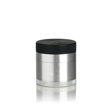 2.2 Kannastör Multi-Chamber Grinder - Silver, showing its cylindrical design with knurled base, grinding chamber, black lid, and magnetic closure for precise herb grinding.