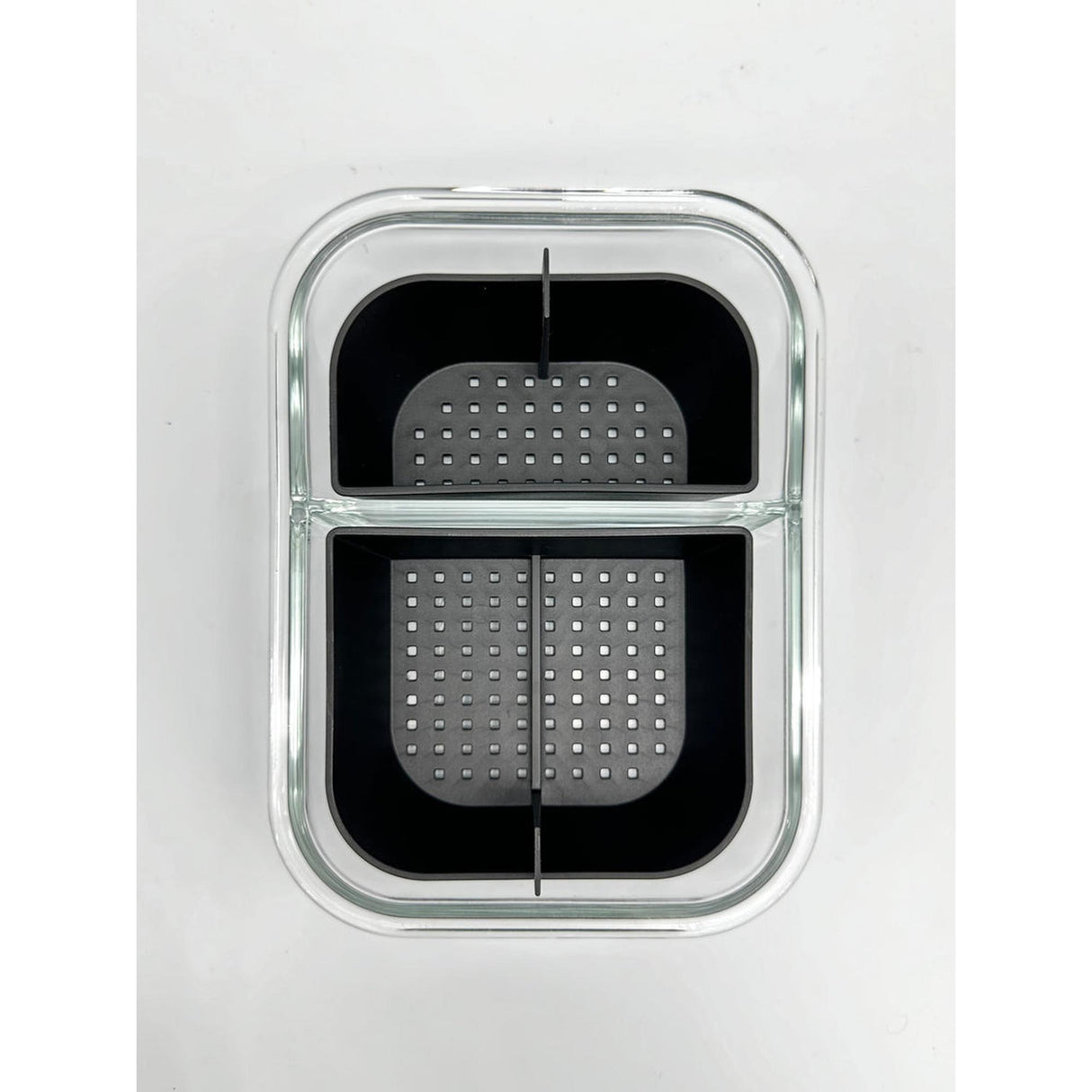 TRIBAL BANGER BASKET featuring a black and grey design, visible as a black plastic container with a grated surface.