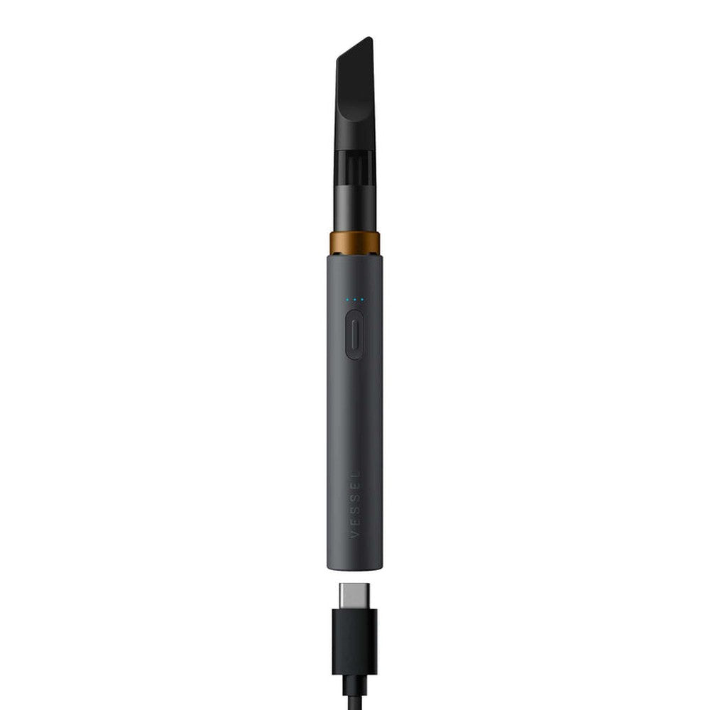 VESSEL Core 510 Thread Battery with a cylindrical design, detachable mouthpiece, gold ring, push-button, LED indicators, and USB-C charging cable connected at the base.