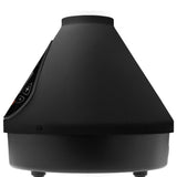 VOLCANO HYBRID Dry Herb Vaporizer features a cone-shaped design with a mist outlet, round base, and slanted control panel for adjusting mist output and runtime.