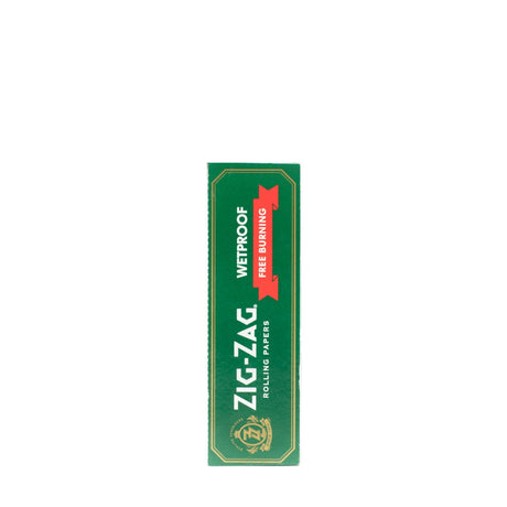Single Wide Green Rolling Paper box, featuring white text and logo, emphasizes its wetproof, slow-burning qualities with natural flax fibers and gum Arabic.