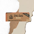 Unbleached 1 1/4 Papers & Tips in a brown box with black text, featuring ultra-thin, slow-burning rolling papers and tips, ideal for natural, seamless rolling.