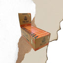 Unbleached 1 1/4 Papers & Tips combo pack on display, showcasing ultra-thin, slow-burning papers with natural gum Arabic and included tips.