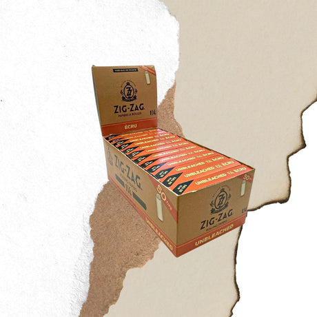 Unbleached 1 1/4 Papers & Tips combo pack on display, showcasing ultra-thin, slow-burning papers with natural gum Arabic and included tips.